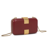 Burgundy evening clutch bag with gold-tone clasp and chain strap, side view