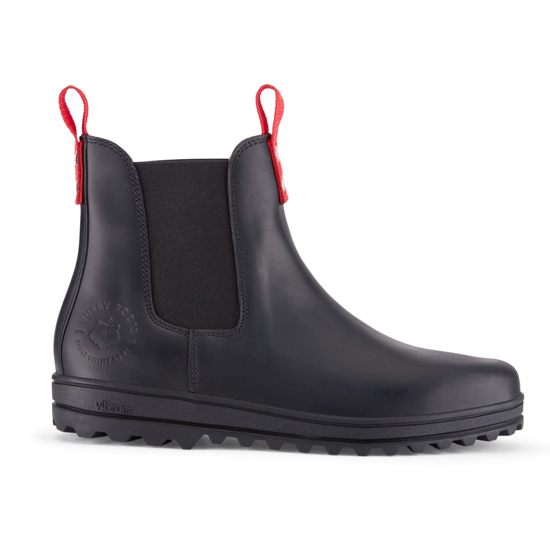Black leather Chelsea boot with elastic side panel, red pull tabs and rugged lug sole.