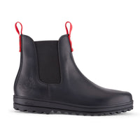 Black leather Chelsea boot with elastic side panel, red pull tabs and rugged lug sole.