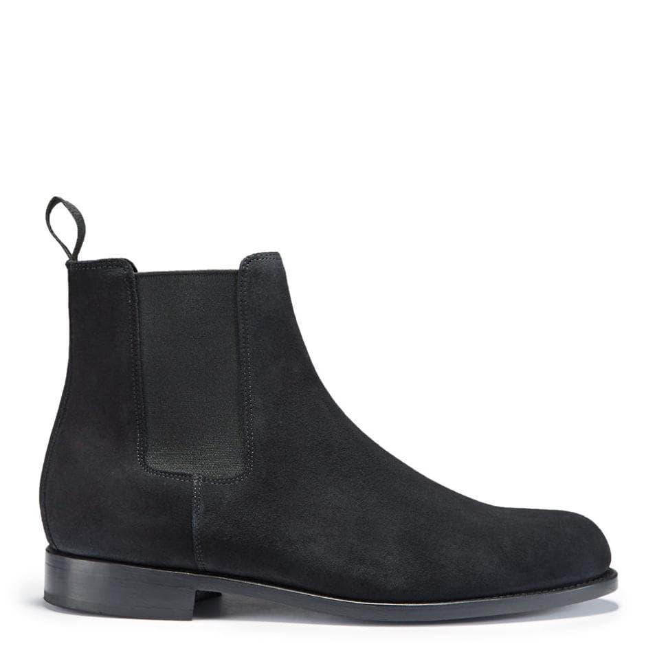 Black suede Chelsea boot with elastic side panel, pull tab, and low heel