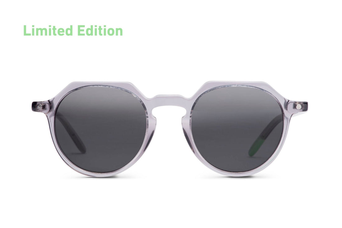 Round sunglasses with transparent gray frame and dark lenses, front view
