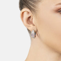 Silver hoop earring with morganite stones on a model's ear