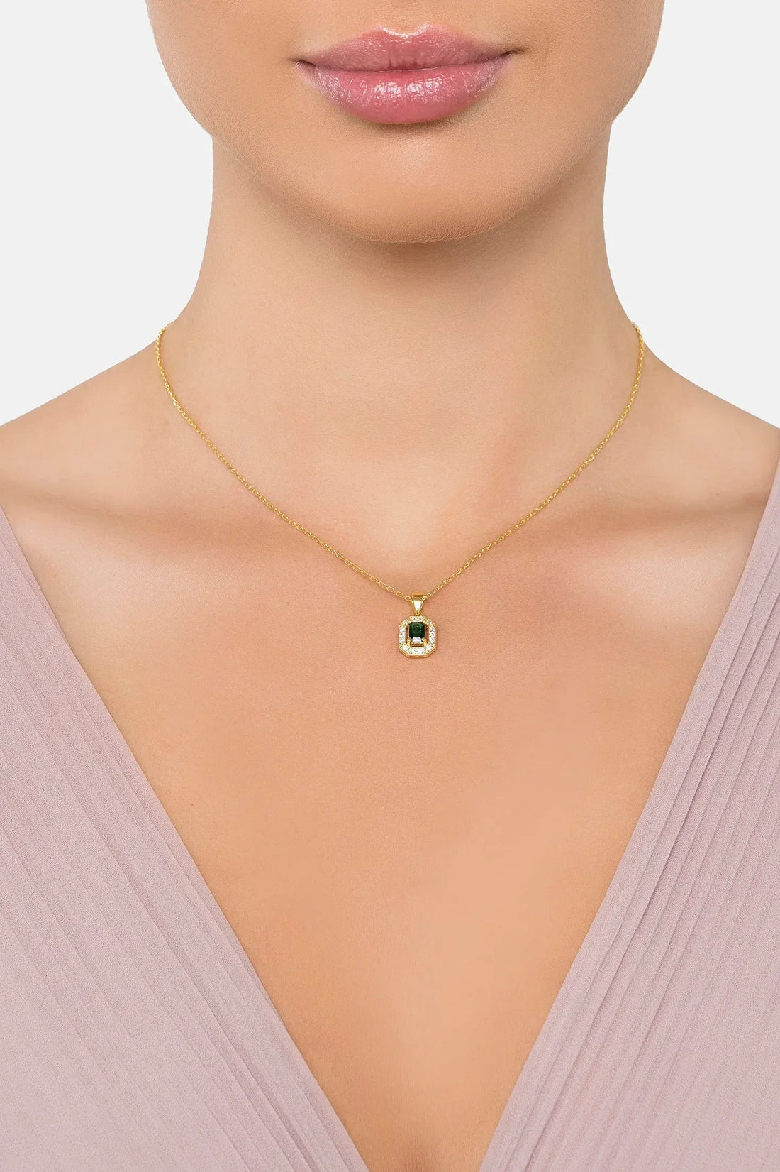 Gold gemstone pendant necklace with small emerald green square pendant