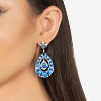 Silver drop earrings with blue teardrop gemstone cluster and hoop-like backing