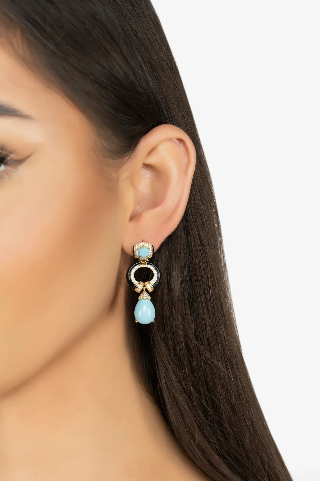 Turquoise and gold-tone drop earrings with circular black center and blue teardrop detail