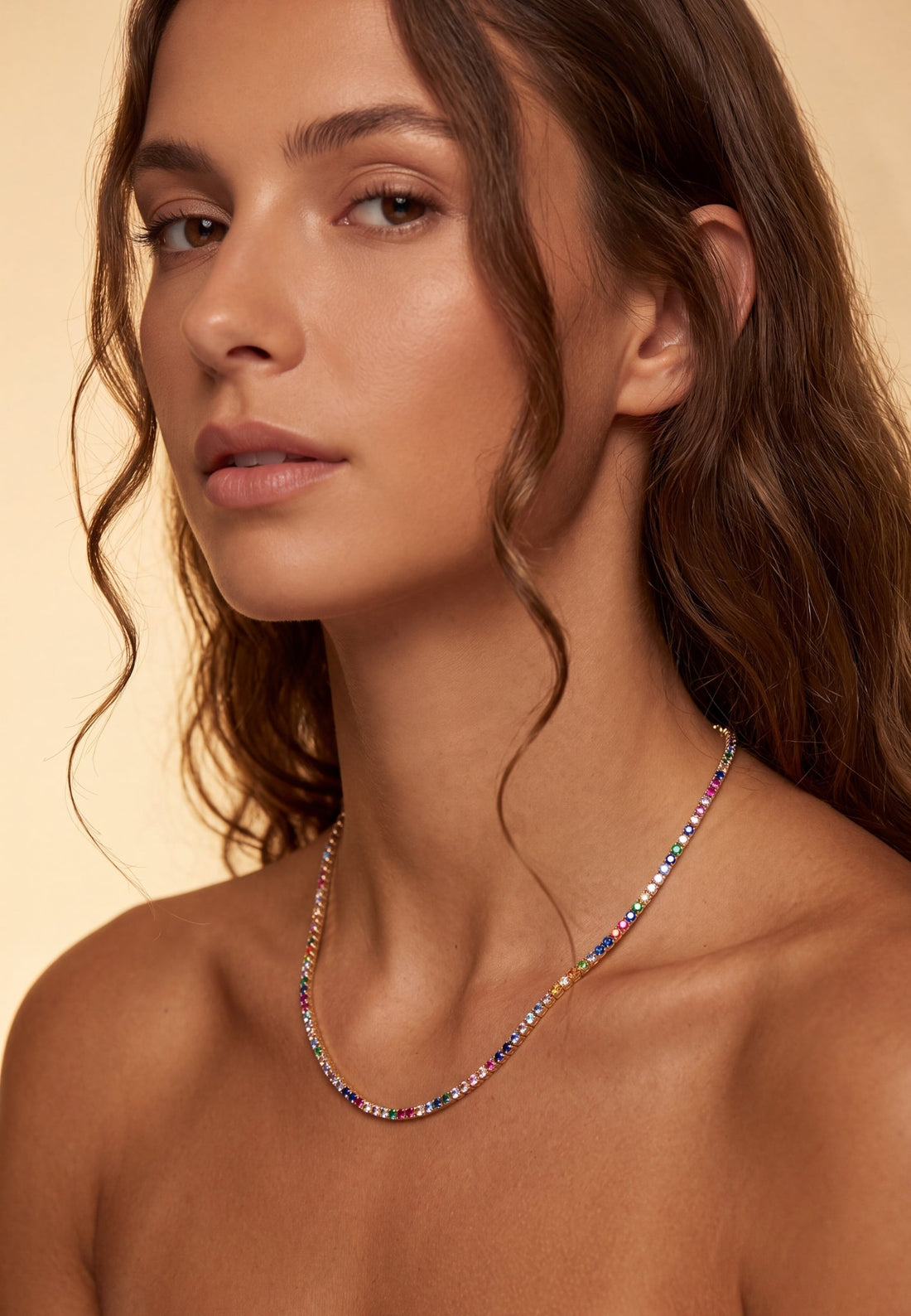 Rainbow CZ tennis necklace on model, gold chain with multicolor stones
