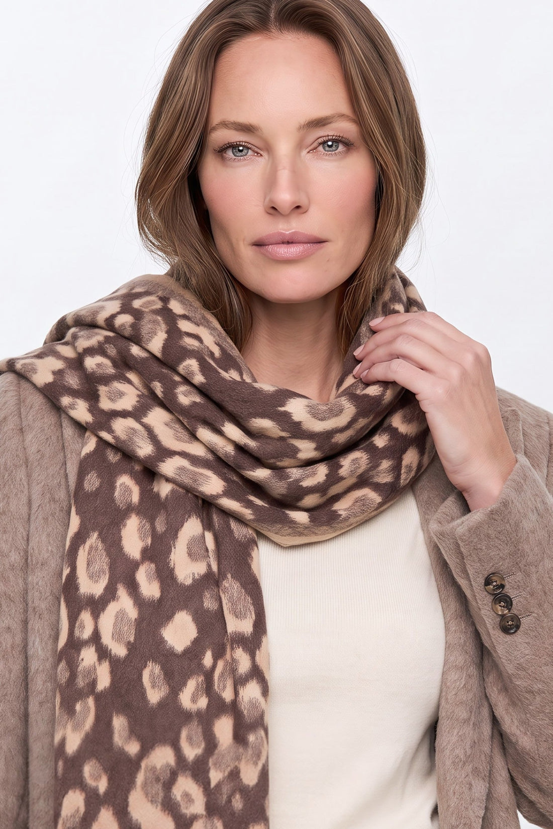 Brown spotted print scarf with fringes, loosely draped around neck