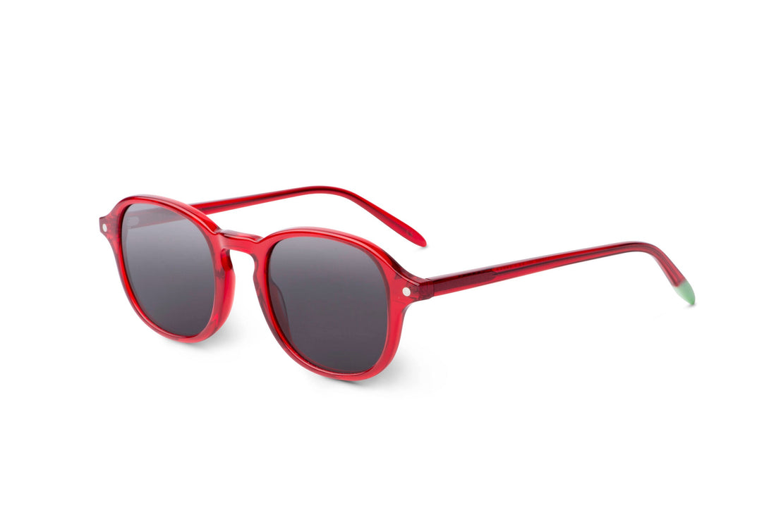 Red round sunglasses side view with dark tinted lenses and slim arms