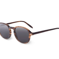 Smoky brown sunglasses side view with dark smoke lenses and green-tipped temples