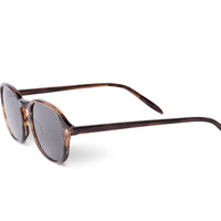 Smoky brown sunglasses angled view with dark smoke lenses and green temple tips
