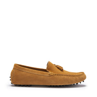 Tan suede driving loafer with tassel detail, contrast stitching, and rubber stud sole