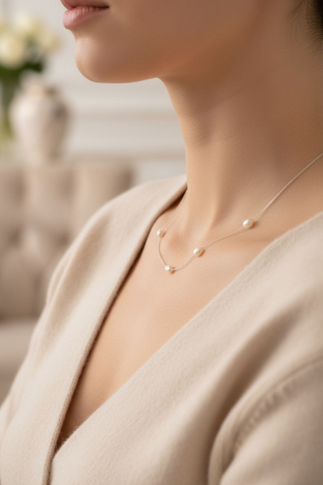Natural pearl necklace with clustered pearls on a white gold chain, close-up
