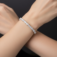 Silver ice cuff bangle with white stones on wrist