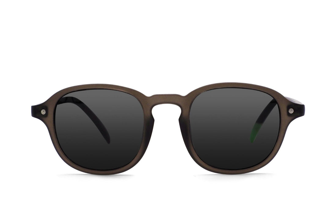 Dark tinted round-lens sunglasses with brown frames and green temple accents