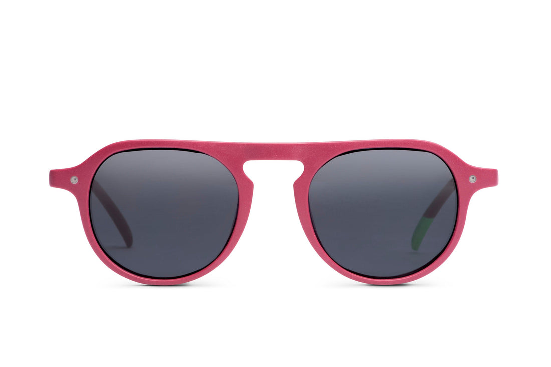 Raspberry pink rounded sunglasses with dark lenses