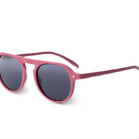 Raspberry pink rounded sunglasses with dark lenses, side view