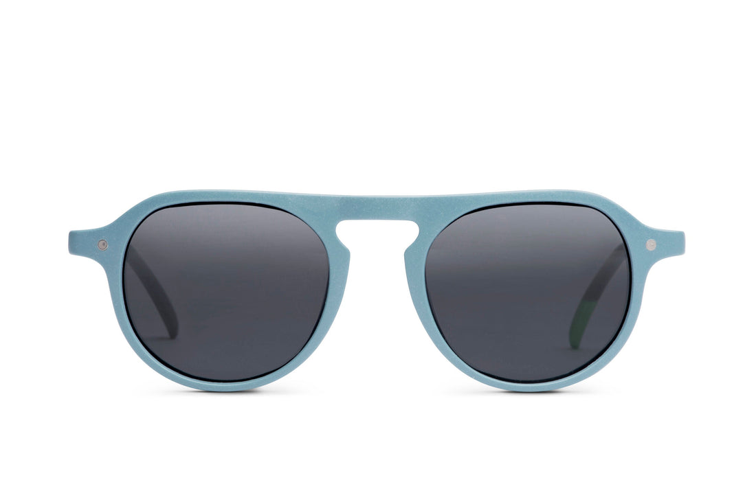Steel blue round sunglasses with dark lenses and sculpted full frame