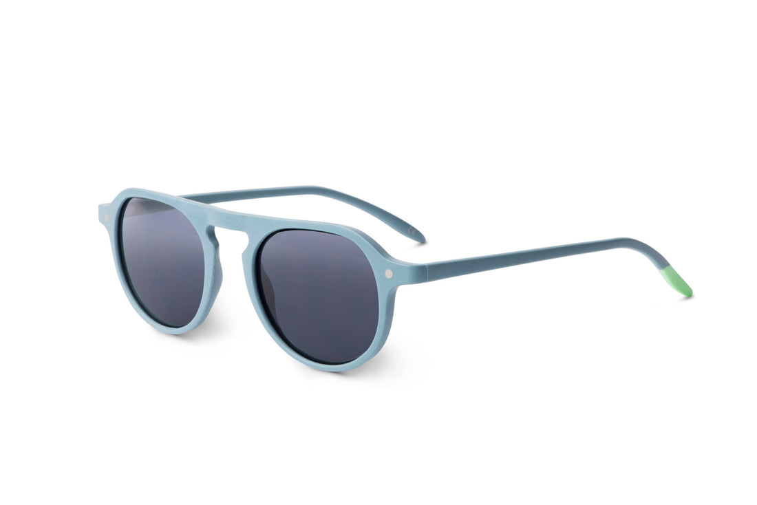 Steel blue sunglasses in side view with dark round lenses and slim metal arms
