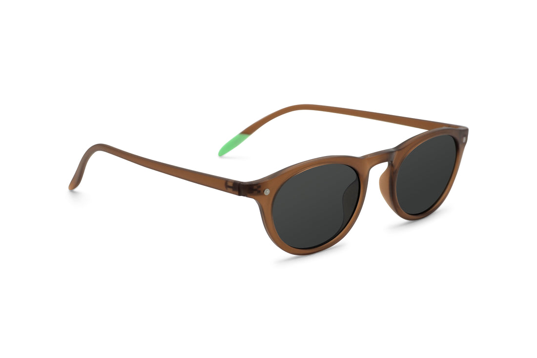 Kilda toffee sunglasses angled side view, brown frame with dark oval lenses