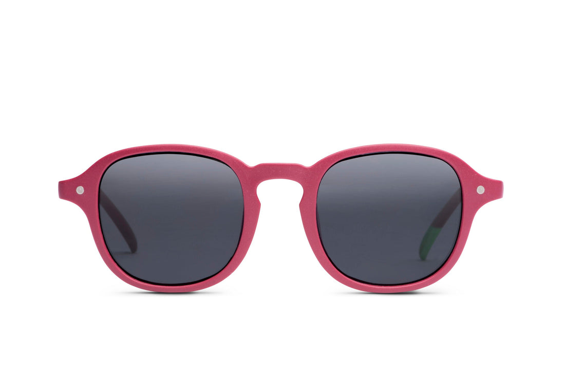 Raspberry sunglasses with dark round lenses and pink frames