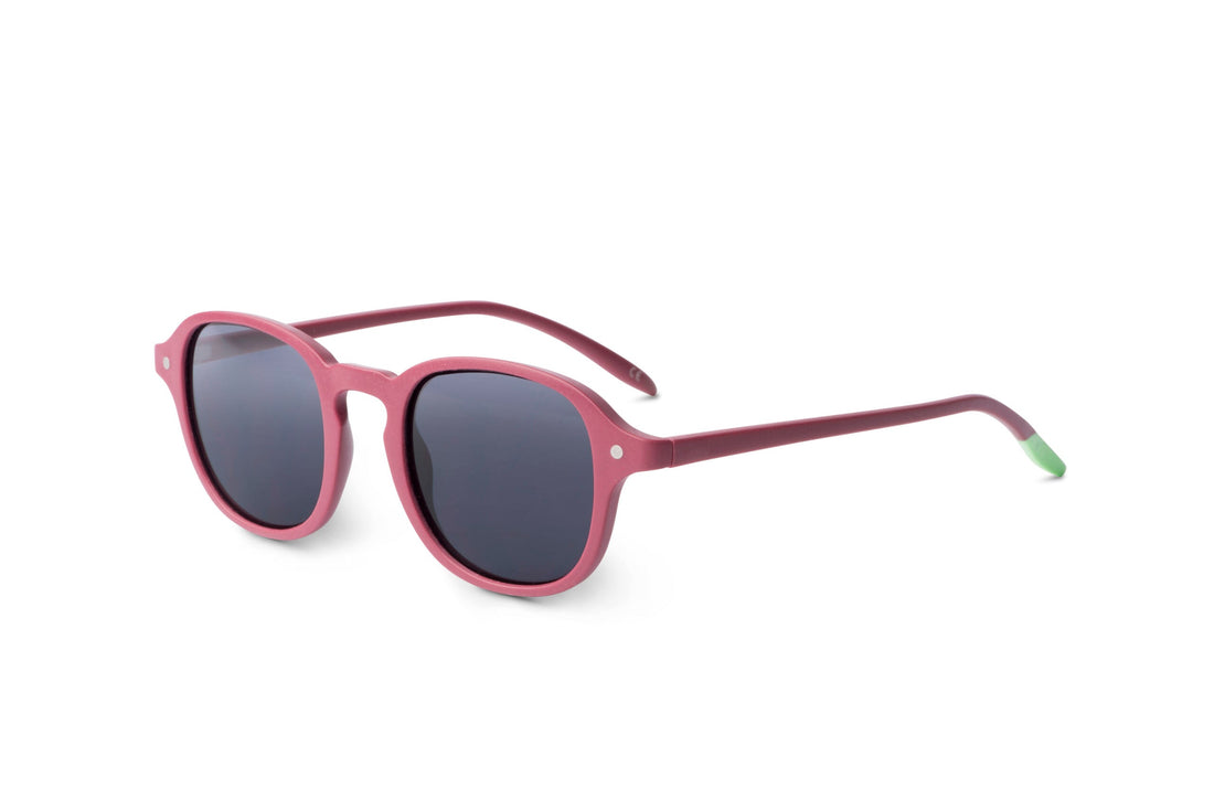 Side view of raspberry sunglasses with dark lenses and curved arms