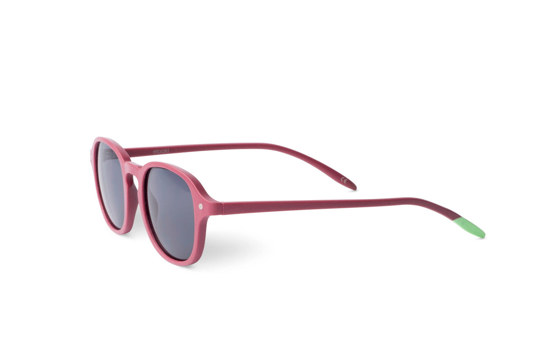 Raspberry sunglasses angled view with dark lenses and green tips