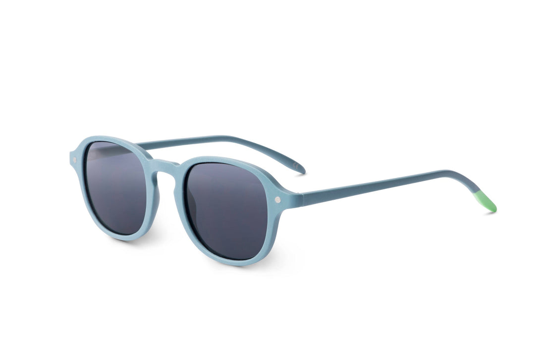 Steel blue sunglasses side view with dark lenses and green-tipped arms