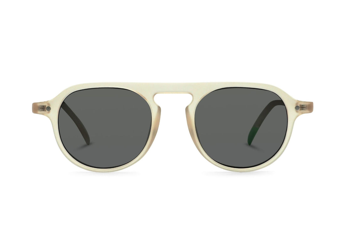 Champagne frame sunglasses with dark lenses, rounded cat-eye shape