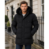 Long black hooded parka with fur trim, quilted sleeves and snap-front closure