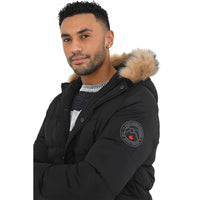 Close-up of black parka sleeve patch and faux fur hood trim