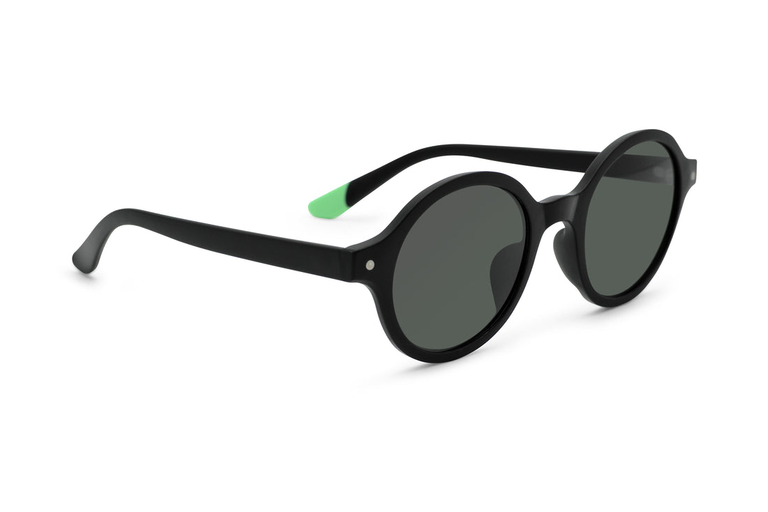 Black round sunglasses, side view with green temple accent and dark lenses