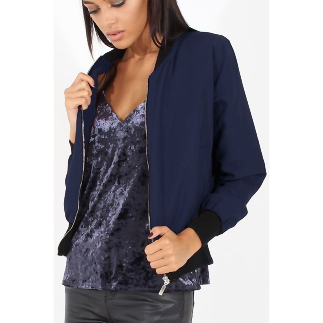 Navy women’s bomber jacket with zip front, ribbed cuffs, and black-trim hem