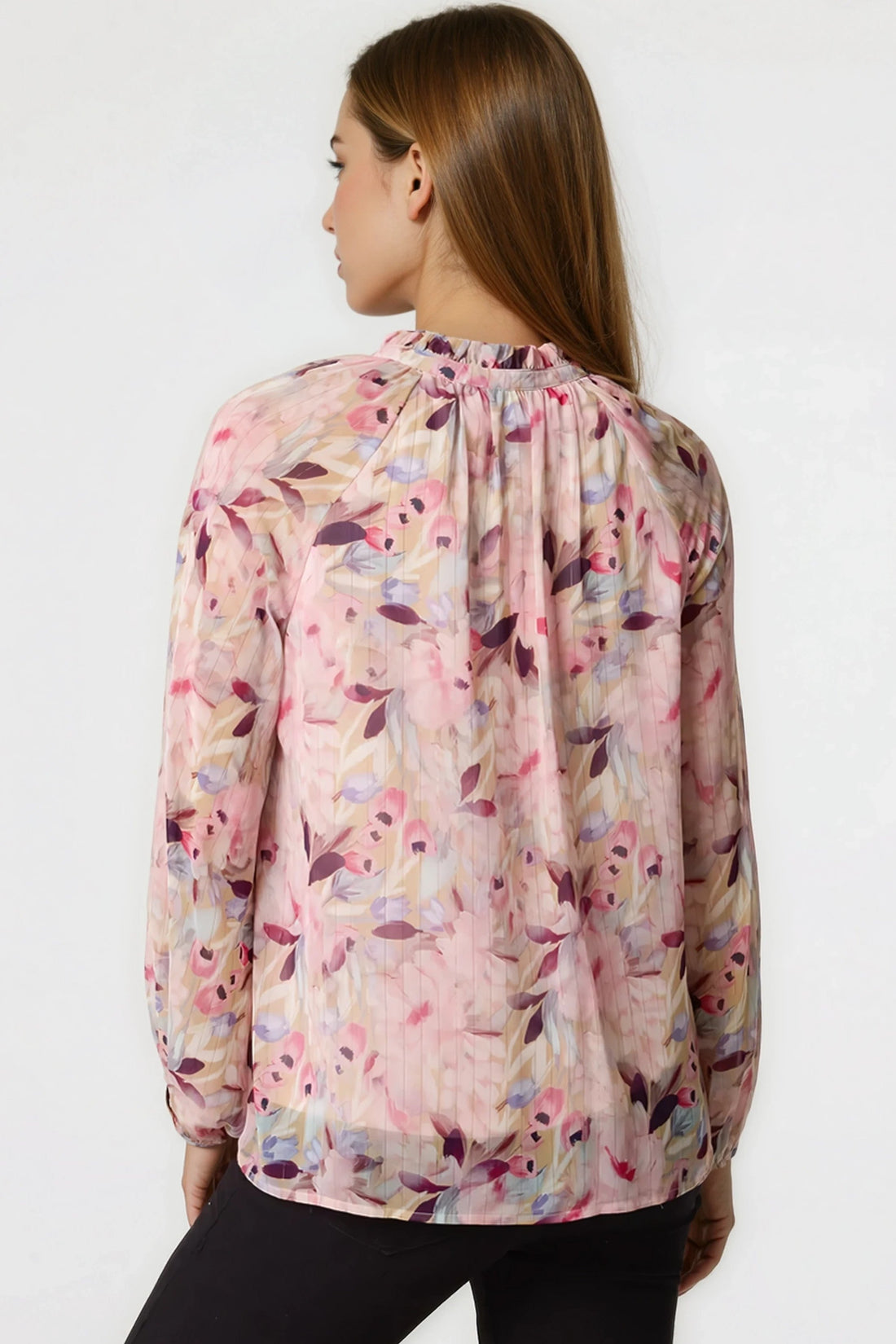 Pink floral blouse with tie neck, sheer blouson sleeves, back view