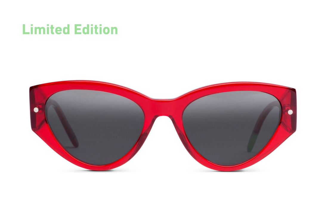 Red cat-eye sunglasses with dark tinted lenses, glossy frame and metal rivets