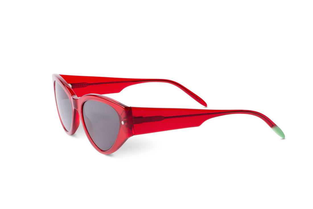 Red sunglasses side view with dark lens and curved temples, green end accents