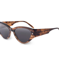 Smokey brown sunglasses angled view, dark lenses and green-tipped temples