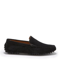 Black suede driving loafer in side view with stitched apron and rubber pebble sole.