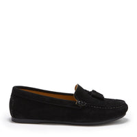 Black suede tassel loafer in side profile with moccasin stitching and a low sole