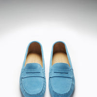 Pair of turquoise suede loafers viewed from above, showing penny straps and tan insoles
