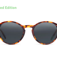 Tortoise acetate sunglasses with dark round lenses and slim arms