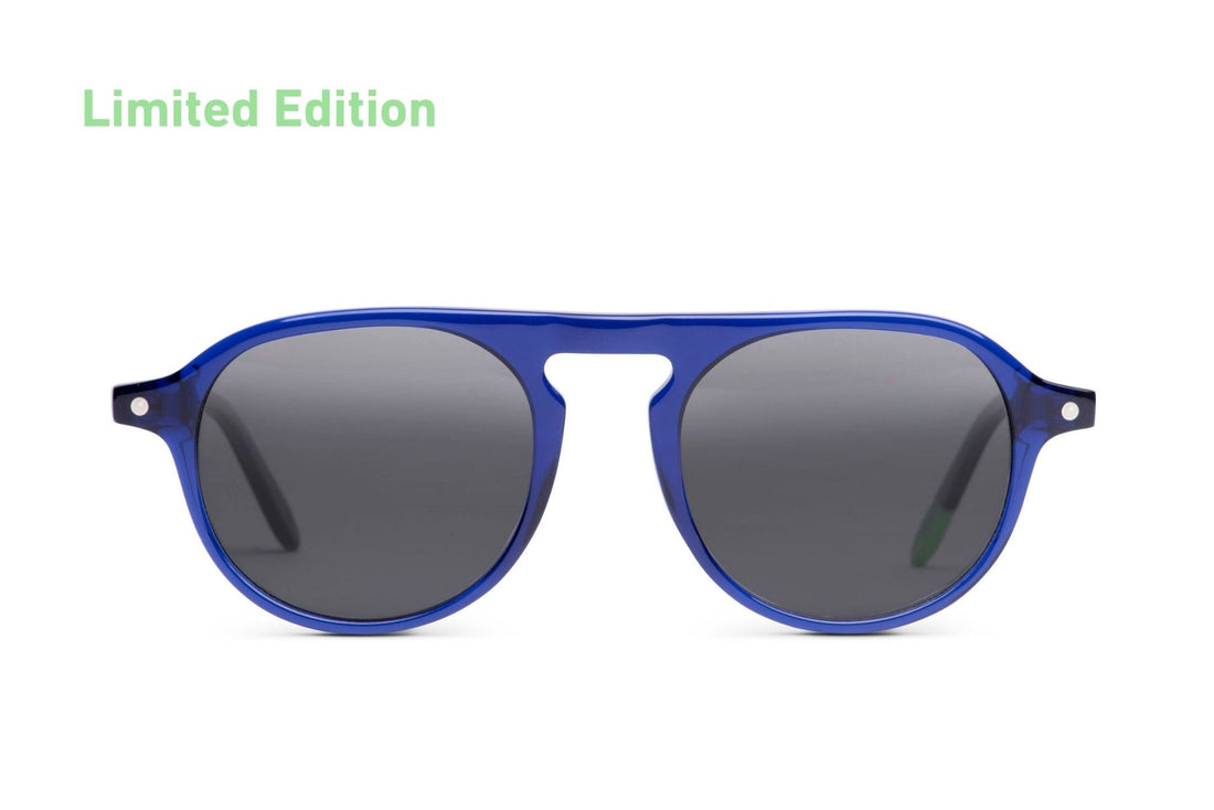 Indigo blue sunglasses with dark oval lenses and keyhole bridge
