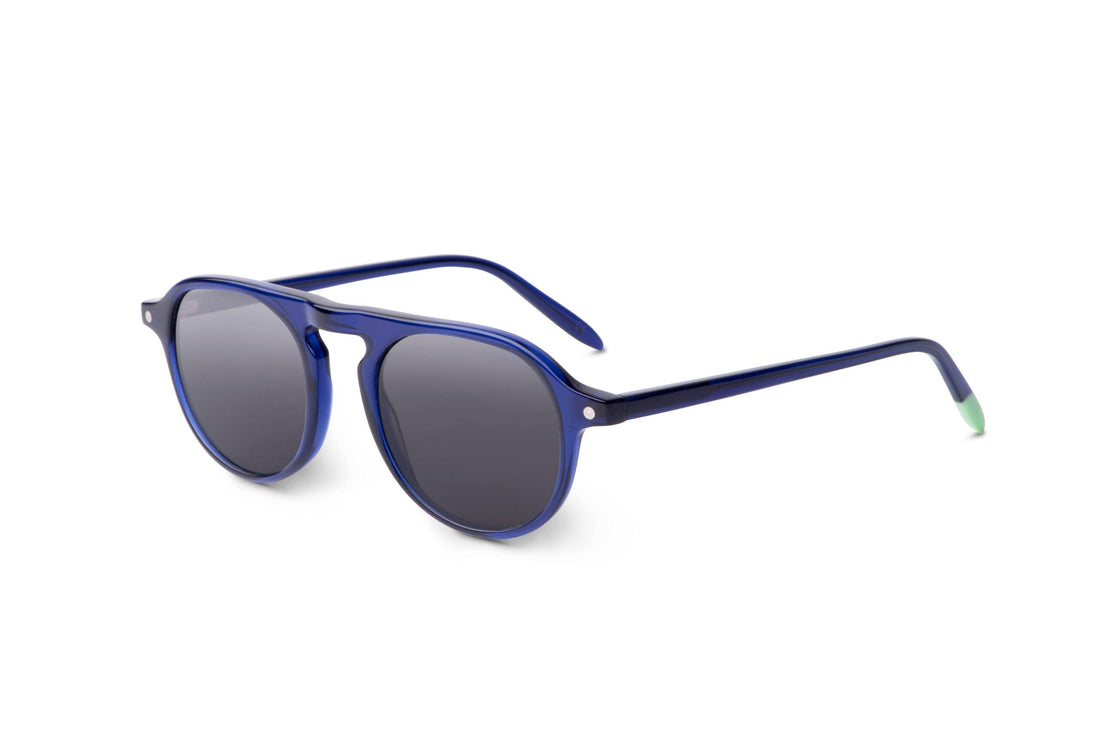 Indigo blue sunglasses, side view, dark lenses with green temple tips