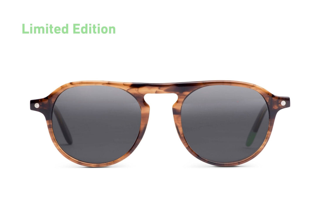 Tortoiseshell brown round sunglasses with dark gray lenses and slim bridge