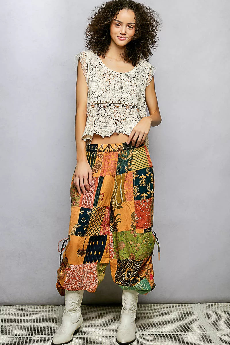 Printed patchwork wide-leg pants with elastic waistband and side drawstring ties