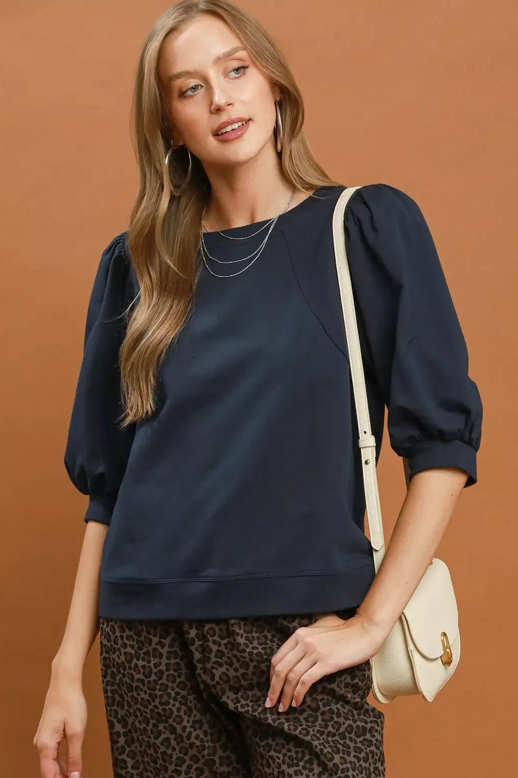 Navy round-neck sweatshirt with puff sleeves, relaxed fit