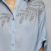 Sky blue button-down embroidered shirt front detail with floral leaf embroidery
