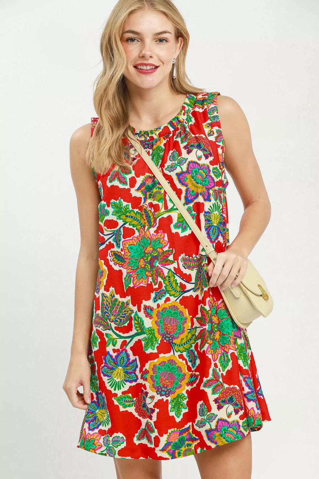 Red sleeveless shift dress with colorful abstract floral print and round neckline