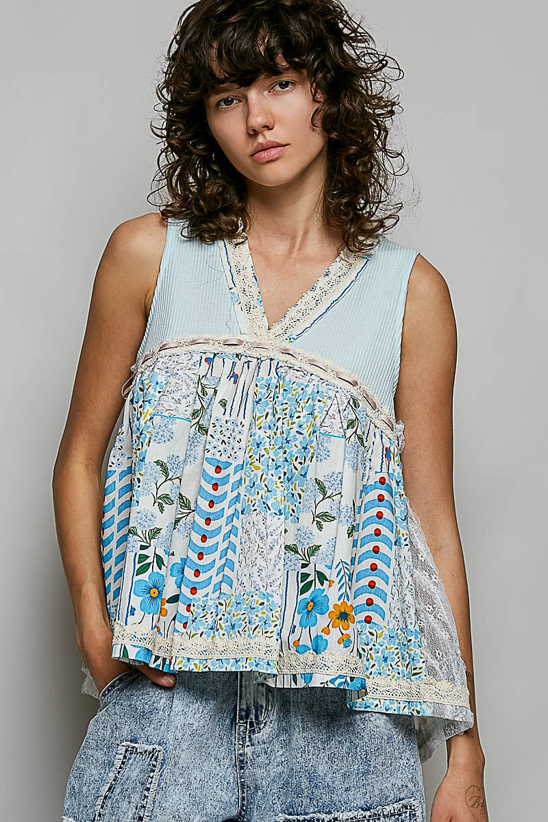 Light blue floral sheer V-neck tank with lace-trim neckline and hem.