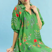 Green floral mini dress close-up, V-neck with puff sleeves and colorful print