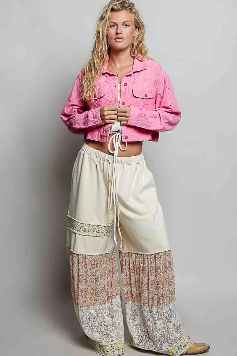 Candy pink cropped cotton jacket with eyelet texture, button front, and long sleeves